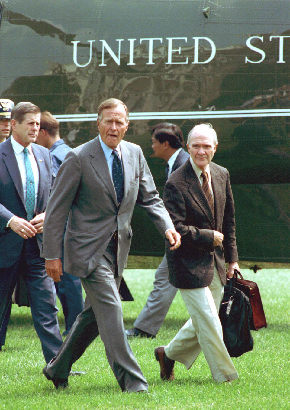 FILE - In this August 19, 1991 file photo, President George Bush, accompanied by National Security Adviser Brent Scowcroft, right, arrives back at the White House after he interrupteed his vacation following the overthrow of Soviet President Gorbachev. A longtime adviser to Presidents Gerald Ford and George H.W. Bush has died. Brent Scowcroft was 95. A spokesperson for the late President Bush says Scowcroft died Thursday of natural causes at his home in Falls Church, Virginia. (AP Photo/Barry Thumma)