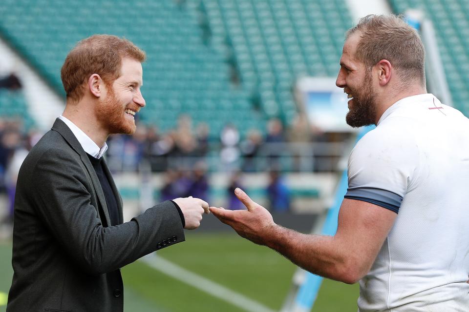 Britain's Prince Harry (L) talks with England rugby player James Haskell (R) as he attends the England rugby team open training session at Twickenham Stadium on February 16, 2018. 
The event at Twickenham Stadium saw thousands of supporters from clubs and schools filling the stands to watch the England senior squad in a training session. This included young people who have benefited from Try for Change, an England Rugby programme which aims to use rugby to improve the lives of disadvantaged people in England and across the world. / AFP PHOTO / POOL / Heathcliff O'Malley        (Photo credit should read HEATHCLIFF O'MALLEY/AFP via Getty Images)