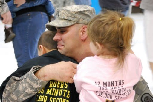 Tears streamed down Steven Farquhar's face as he hugs his children at a welcome home ceremony at an Iowa National Guard facility on November 23. He is home after his fourth -- and final -- deployment to Iraq