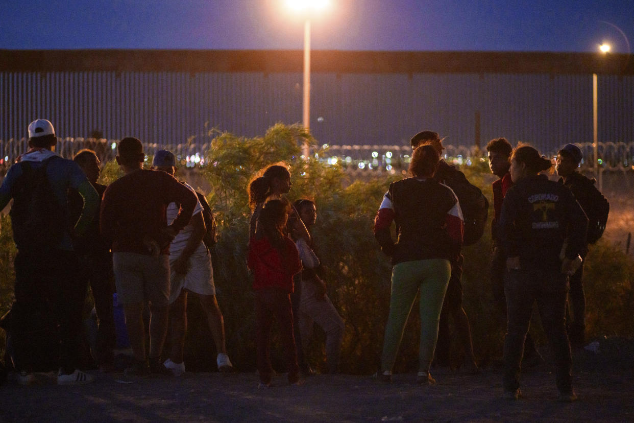 Migrants look for a place to cross the U.S.-Mexico border in Ciudad Juarez, Mexico, on Tuesday night, June 4, 2024. (Paul Ratje/The New York Times)