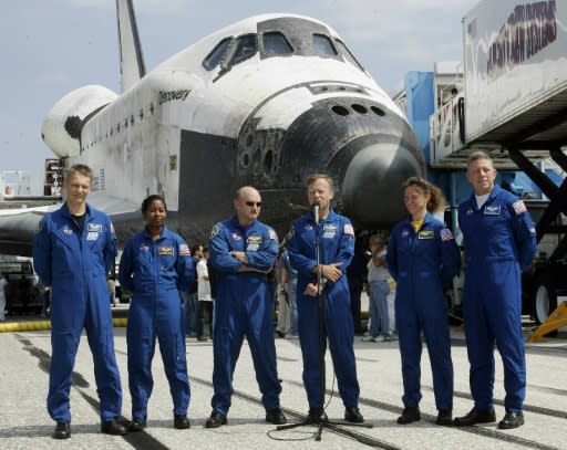 Lisa Nowak, pictured with her Discovery crew mates in 2006, was arrested for attacking a love rival