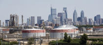 The Philadelphia Energy Solutions Refining Complex in Philadelphia is shown Wednesday, June 26, 2019. The owner of the largest oil refinery complex on the East Coast is telling officials that it will close the facility after a fire last week set off explosions and damaged the facility. Philadelphia Mayor Jim Kenney said in a Wednesday, June 26, statement that Philadelphia Energy Solutions has informed him of its decision.. (AP Photo/Matt Rourke)