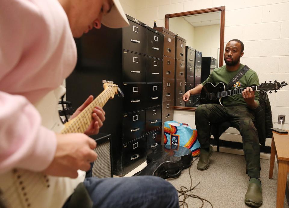 Guitar student Blake Smith plays as Akron jazz guitarist Dan Wilson, the newest faculty member for the University of Akron jazz program, listens during a lesson in Wilson's office in Guzzetta Hall.
