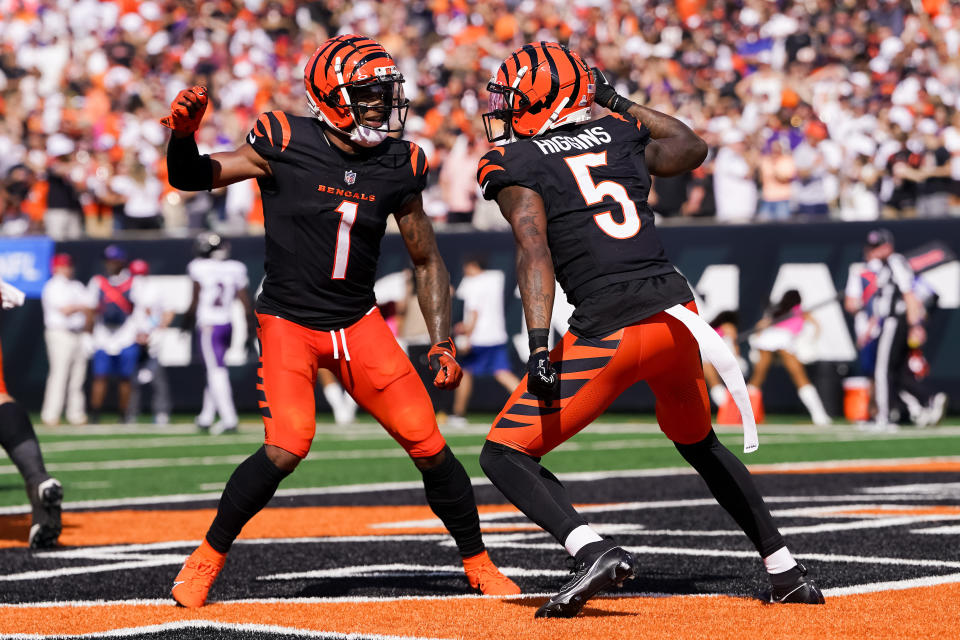 Ja'Marr Chase #1 and Tee Higgins #5 of the Cincinnati Bengals 