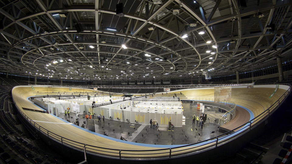 Interior view of a new coronavirus, COVID-19, vaccination center at the 'Velodrom' (velodrome-stadium) in Berlin, Germany, Wednesday, Feb. 17, 2021. (AP Photo/Michael Sohn, pool)