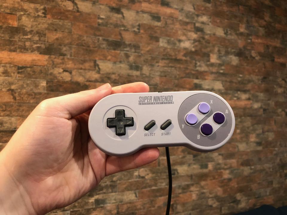 Nintendo not only made the SNES controllers full-size, the company also throws in a second one for two-player games.