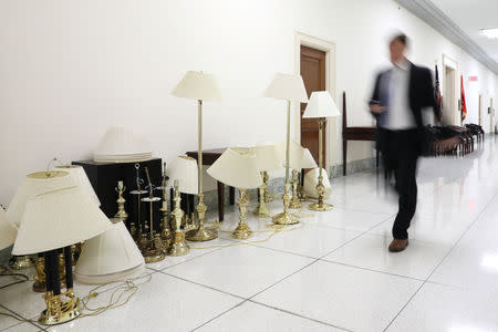 Furniture to be moved sits in the hall outside of U.S. Congressional offices weeks before the end of the current term, as dozens of outgoing and incoming members of Congress move into and out of Washington as votes on a potential federal government shutdown loom, on Capitol Hill in Washington, U.S., December 17, 2018. REUTERS/Jonathan Ernst