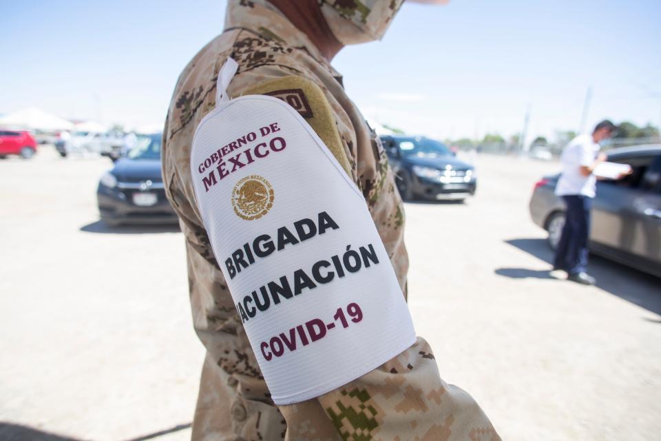 A Mexican soldier wears an armband reading "COVID-19 Vaccination Brigade" as part of the vaccination efforts in Juárez on Monday, April 12, 2021.
