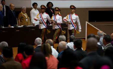 Honour guards carry the new constitution at the National Assembly, in Havana, Cuba April 10, 2019. Irene Perez/Courtesy Cubadebate/Handout via REUTERS
