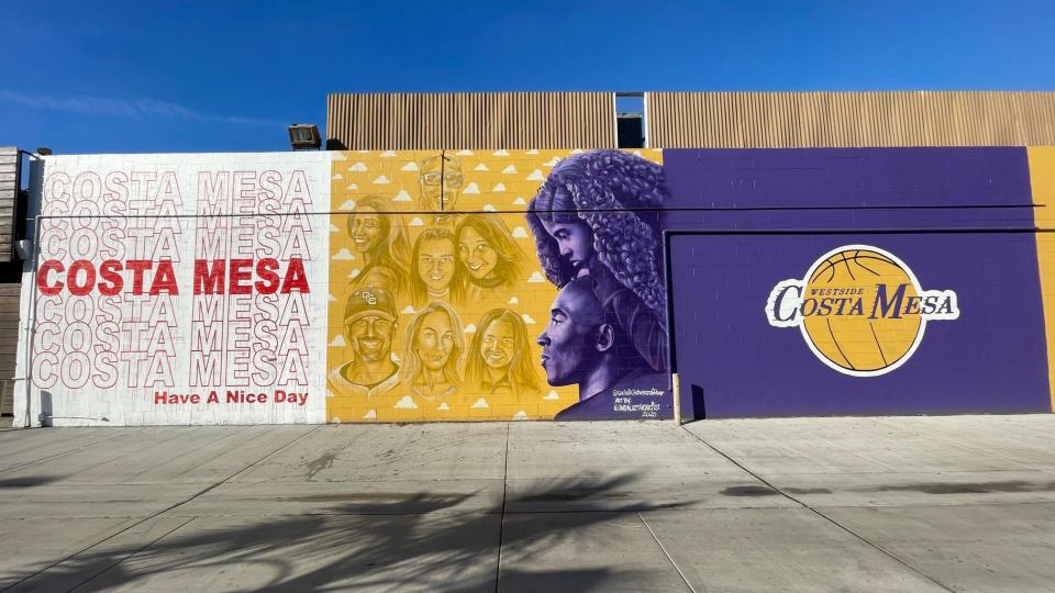 In this file photo from 2021, the owner of Social Costa Mesa restaurant commissioned Andaluz the Artist of New York to paint this mural honoring Kobe Bryant, believed to be the only mural that features images of all nine people who were killed in the helicopter crash that took the basketball star's life.