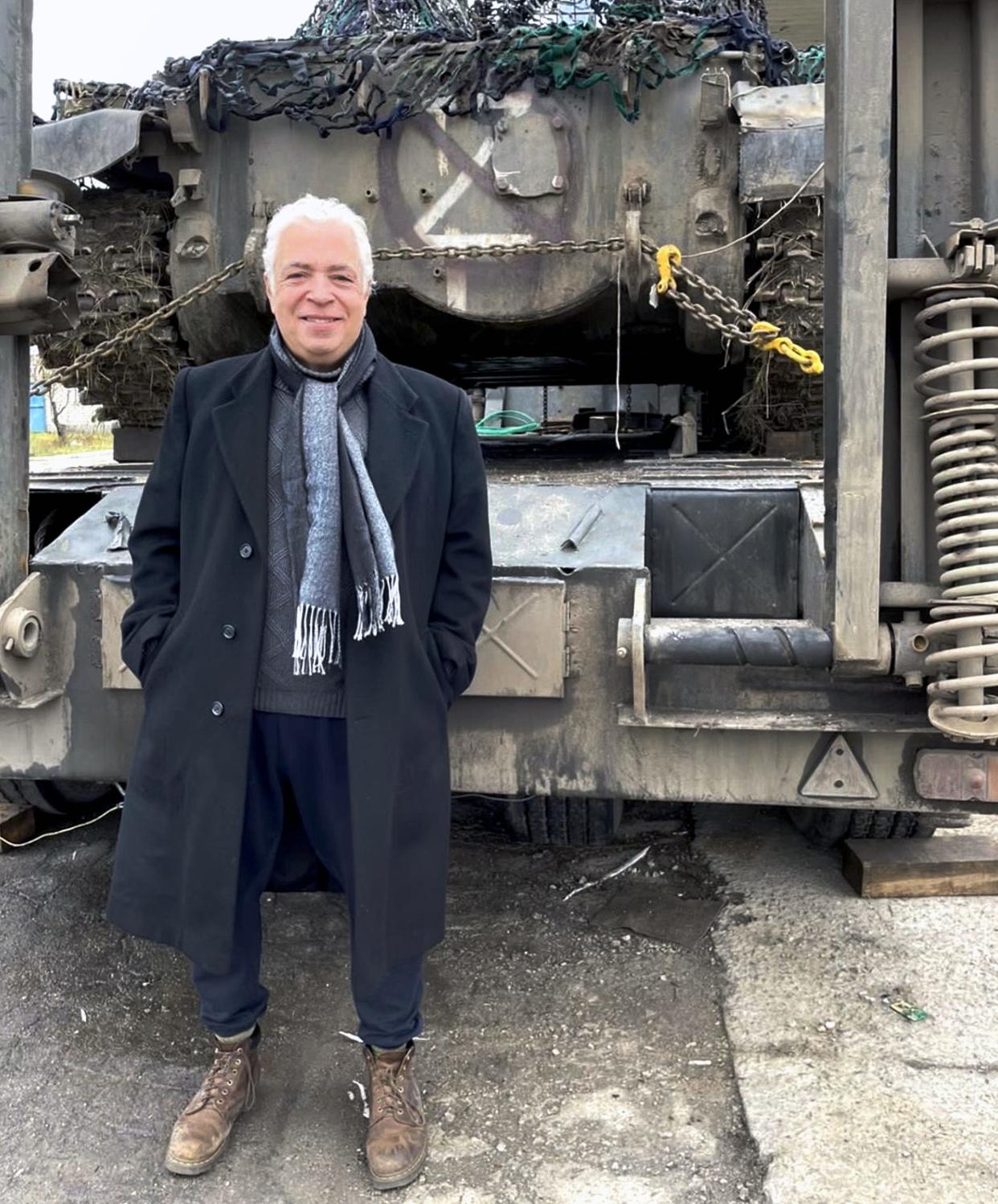 Author, Timothy Morales stands in front of a captured Soviet-era BMP, an amphibious combination armored personnel carrier and infantry tank, at a military post off a side road of the Mykolaiv Highway between Kherson and Odesa. [Photo provided]