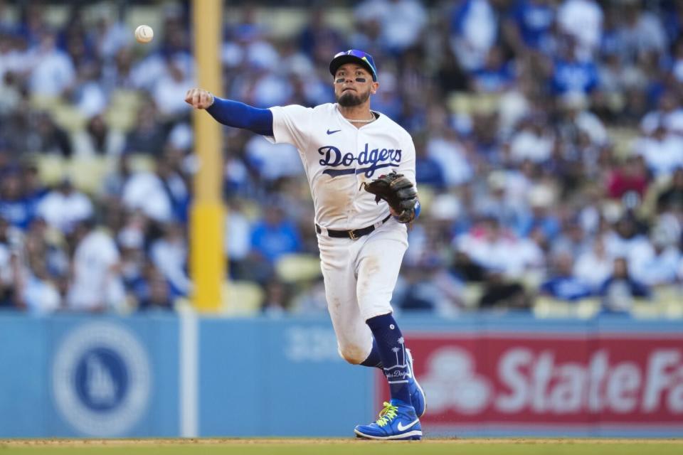 Dodgers shortstop Miguel Rojas throws to first against the New York Yankees on June 3, 2023, at Dodger Stadium.