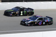 Kurt Busch (1) and Kevin Harvick (4) practice for a NASCAR Cup Series auto race at Michigan International Speedway in Brooklyn, Mich., Saturday, Aug. 10, 2019. (AP Photo/Paul Sancya)