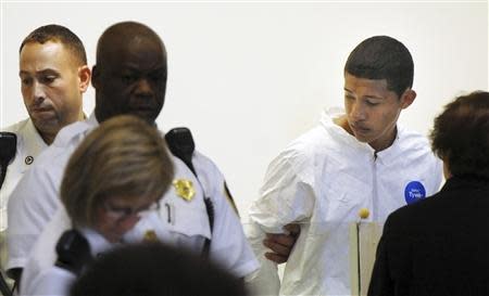 Philip Chism, 14, stands during his arraignment for the death of Danvers High School teacher Colleen Ritzer in Salem District Court in Boston, Massachusetts October 23, 2013. REUTERS/Patrick Whittemore/Pool