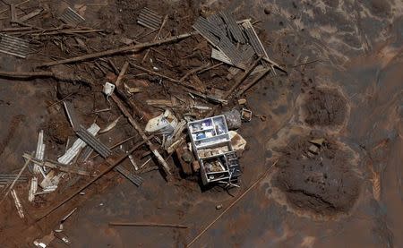 A cupboard is pictured in debris in Bento Rodrigues district, which was covered with mud after a dam owned by Vale SA and BHP Billiton Ltd burst, in Mariana, Brazil, November 10, 2015. REUTERS/Ricardo Moraes