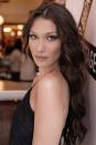 <p>To recreate Bella Hadid's sleek, loose waves, start by prepping your hair with Kérastase's <a rel="nofollow noopener" href="https://www.lookfantastic.com/kerastase-discipline-fluidissime-spray-150ml/10951821.html?affil=thggpsad&switchcurrency=GBP&shippingcountry=GB&gclid=CjwKCAjw0ujYBRBDEiwAn7BKt1rIRqVDsIQ6tpPB_FlBUoycPtW6NEsOwl9SxExE2ZUzGhlBM8QGrBoCYq8QAvD_BwE&gclsrc=aw.ds&dclid=COmDrcztw9sCFdgTGwodPScM1g" target="_blank" data-ylk="slk:Discipline Fluidissime Spray;elm:context_link;itc:0;sec:content-canvas" class="link ">Discipline Fluidissime Spray</a>, £16, to protect against heat damage. Then, take small sections and twist them around Ghd's <a rel="nofollow noopener" href="https://www.ghdhair.com/wands/ghd-curve-classic-wave-wand?CMP=EMC-555&PLA=301&CRE=BRAND&TYPE=sponsoredsearch&gclid=CjwKCAjw0ujYBRBDEiwAn7BKty0lKZOlCd2Aore8gsOrY9c1-hWLxqmFlsr5A0Ms0SZ_y-Dwk-YmoBoCiXUQAvD_BwE&gclsrc=aw.ds" target="_blank" data-ylk="slk:Classic Wave Wand;elm:context_link;itc:0;sec:content-canvas" class="link ">Classic Wave Wand</a>, £108, in the same direction for uniformity, before gently brushing through the curls for a softer wave. Finish with a spritz of Sam McKnight's <a rel="nofollow noopener" href="https://www.libertylondon.com/uk/modern-hairspray-250ml-R158320006.html?dwvar_000559113_color=98-NO%20COLOUR&referrer=departments&gclid=CjwKCAjw0ujYBRBDEiwAn7BKt-OgO00XYvsx439QCb7gwVSlVVASA4XsB3EAMIkKWtU4Ea4IN_vd4hoCGMUQAvD_BwE" target="_blank" data-ylk="slk:Modern Hairspray;elm:context_link;itc:0;sec:content-canvas" class="link ">Modern Hairspray</a>, £22, to keep them in place. </p>