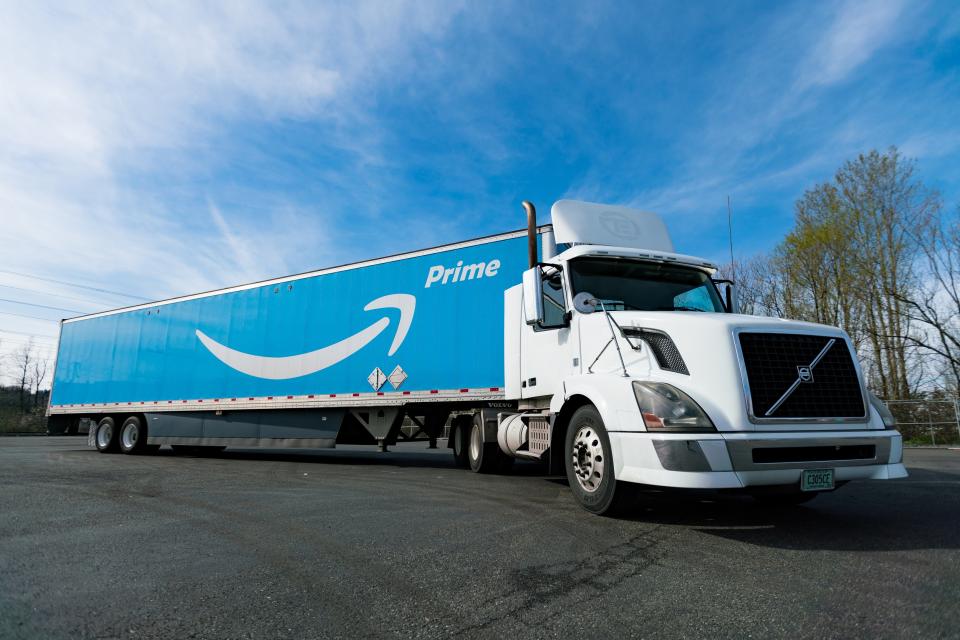 An Amazon Prime-branded truck in a parking lot