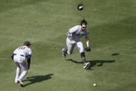 A single by Boston Red Sox's Xander Bogaerts falls between Houston Astros' Yuli Gurriel (10) and Jake Marisnick during the fifth inning of a baseball game Sunday, May 19, 2019, at Fenway Park in Boston. (AP Photo/Winslow Townson)