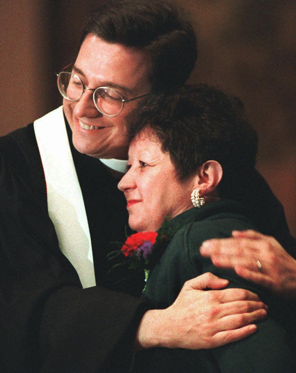 Norma McCorvey, the "Jane Roe" in the 1973 Roe v. Wade decision, is embraced by The Rev. Robert L. Schenck of the National Clergy Council before she addresses a memorial service at Georgetown University on Jan. 21, 1996.