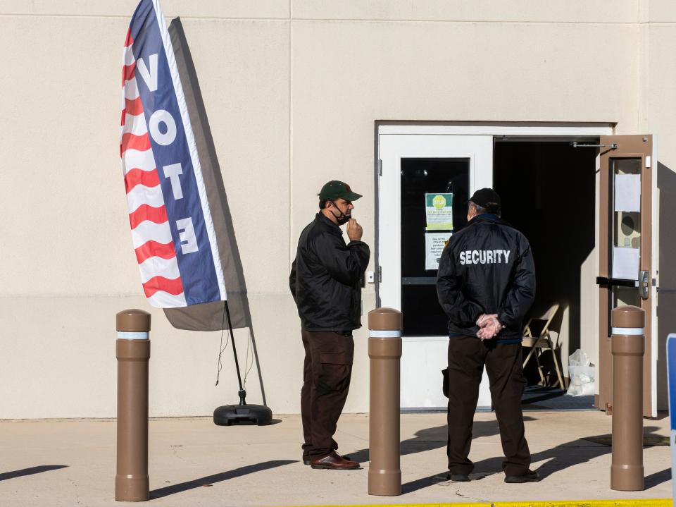 A private security guard outside a polling center in Tallahassee, Florida, November 3, 2020.
