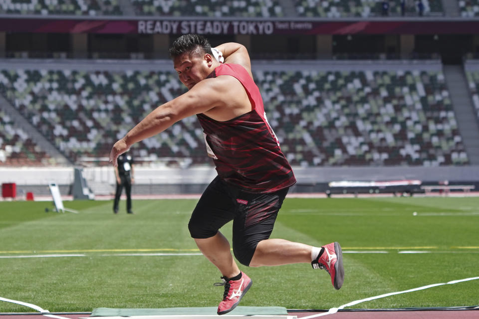 Japanese Daichi Nakamura performs a shot put at an athletics test event for the Tokyo 2020 Olympics Games at National Stadium in Tokyo, Sunday, May 9, 2021. (AP Photo/Shuji Kajiyama)