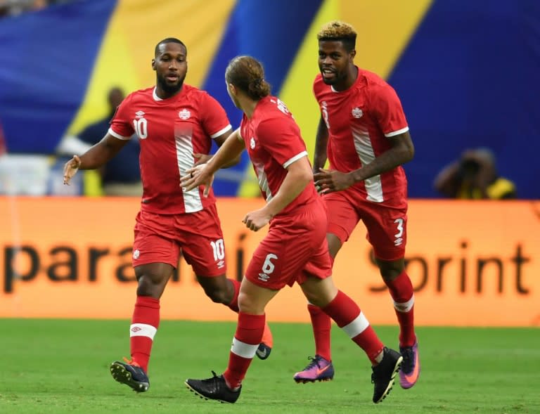 Canada's David Jr. Hoilett (L) celebrates with teammates after scoring a goal during their 2017 CONCACAF Gold Cup quarter-final match, at the University of Phoenix Stadium in Glendale, Arizona, on July 20