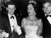 <p>Elizabeth Taylor wearing a sheer floral printed fit-and-flare swing dress with a tiara, naturally. </p>