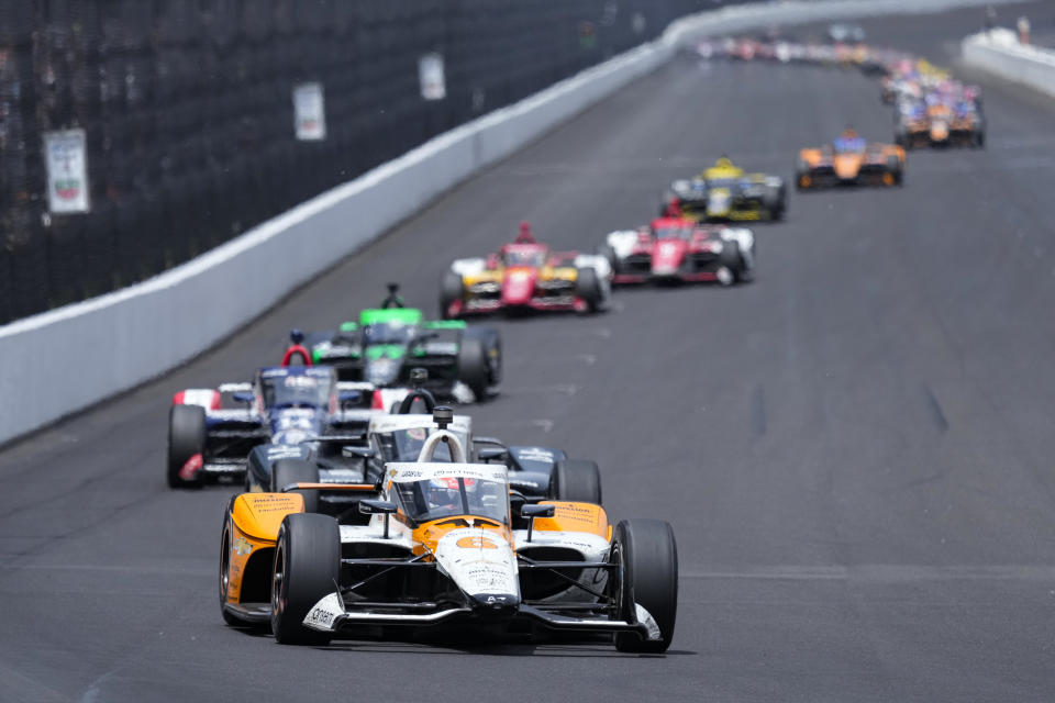 Felix Rosenqvist, of Sweden, leads the field into the first turn during the Indianapolis 500 auto race at Indianapolis Motor Speedway in Indianapolis, Sunday, May 28, 2023. (AP Photo/AJ Mast)