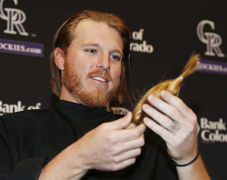 Rockies starting pitcher Jon Gray parts with an eight-inch ponytail after cutting his hair of 