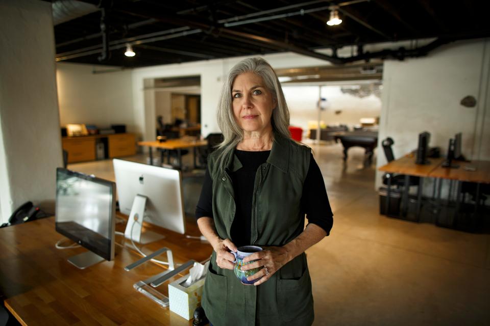 Lauren Anderson poses in the empty offices of her branding and marketing firm The Creative Department in the Pendleton neighborhood of Cincinnati on Friday, Sept. 25, 2020. Anderson struggled to adjust as the pandemic and economy forced her to employees to work from home and lost revenue forced layoffs. 