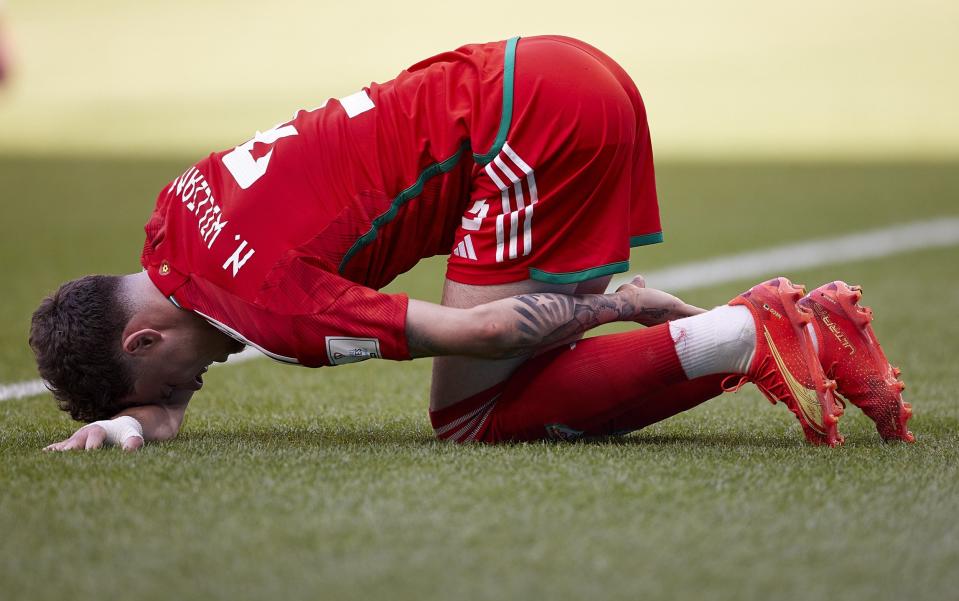 Neco Williams of Wales reacts during the FIFA World Cup Qatar 2022 Group B match between Wales and IR Iran at Ahmad Bin Ali Stadium - Getty Images