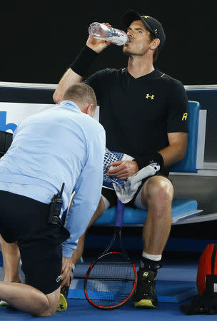 Tennis - Australian Open - Melbourne Park, Melbourne, Australia - 18/1/17 Britain's Andy Murray receives medical attention after falling during his Men's singles second round match against Russia's Andrey Rublev. REUTERS/Thomas Peter