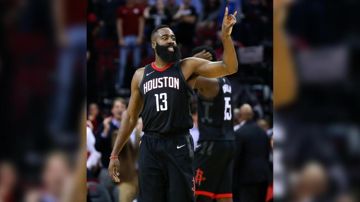 HOUSTON, TX - JANUARY 30:  James Harden #13 of the Houston Rockets celebrates after a three-point shot.