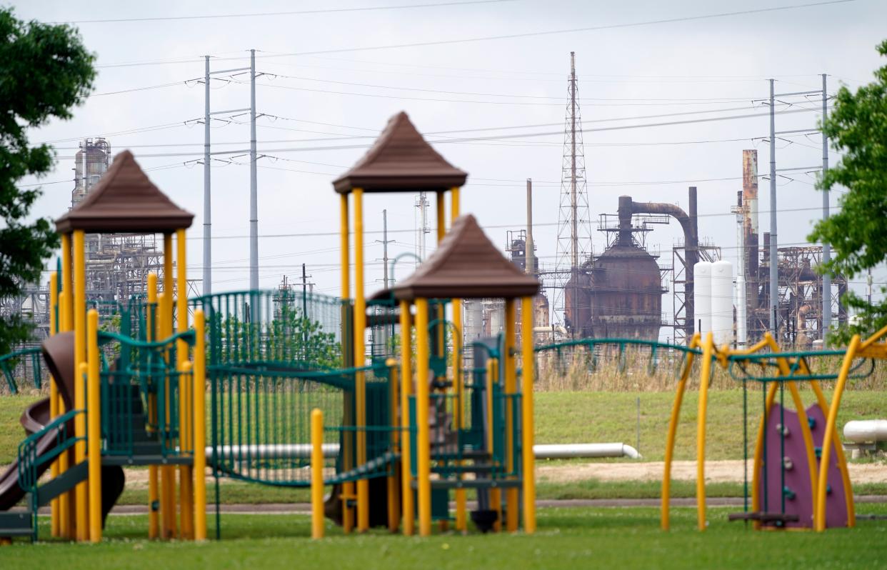 <p>In this Monday, March 23, 2020 file photo, a playground outside the Prince Hall Village Apartments sits empty near one of the petrochemical facilities in Port Arthur, Texas. According to a study published Wednesday, April 28, 2021 in the journal Science Advances,  across America, people of color are disproportionately exposed to air pollution from industry, vehicles, construction and many other sources. (AP Photo/David J. Phillip)</p> (AP)