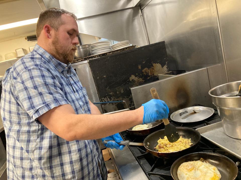 Michael Bissonette, co-owner of The Dutch Mill Diner in Shelburne, scrambles eggs for a breakfast burrito Jan. 26, 2024.