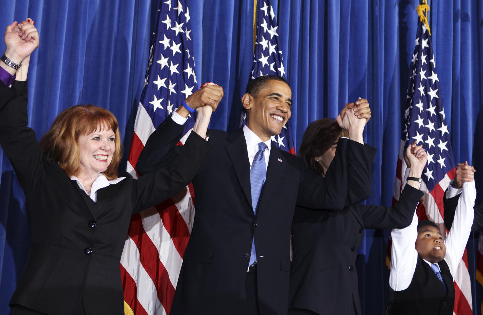 U.S. President Barack Obama holds a rally celebrating the passage and signing into law of the Patient Protection and Affordable Care Act health insurance reform bill while at the Interior Department in Washington, March 23, 2010. (L-R) Connie Anderson, of Seville, Ohio, Obama, Vicki Kennedy, wife of former Sen. Edward Kennedy, and 11 year-old Marcelas Owens, of Seattle, Washington.     REUTERS/Larry Downing  (UNITED STATES - Tags: POLITICS HEALTH)