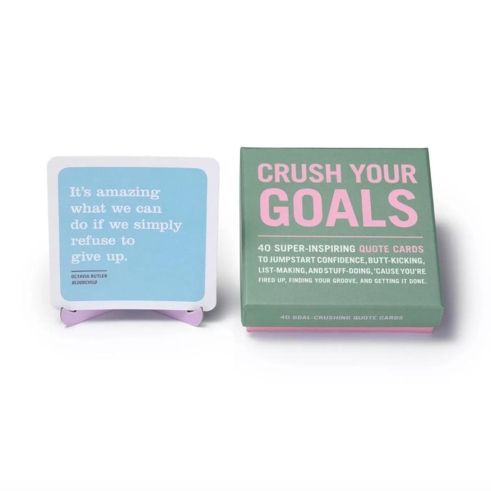 Left blue card reads, "It's amazing what we can do if we simply refuse to give up." Right green affirmation deck with pink lettering reads, "Crush your goals."