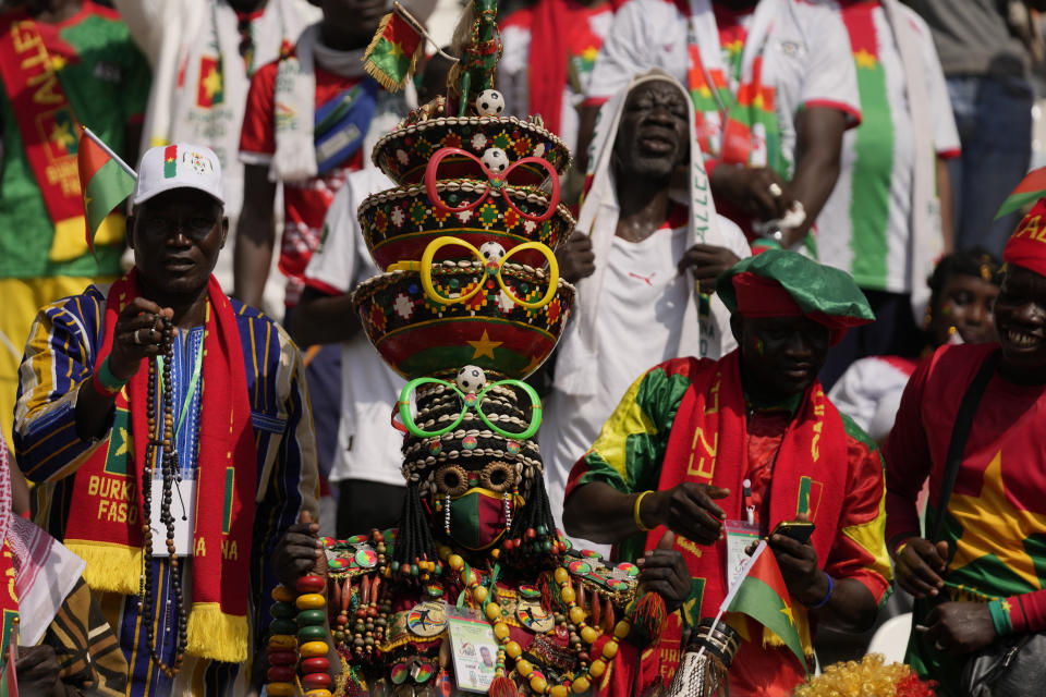 Burkina Faso supporters cheer during the African Cup of Nations Group D soccer match between Algeria and Burkina Faso at the Peace of Bouake stadium in Bouake, Ivory Coast, Saturday, Jan. 20, 2024. (AP Photo/Themba Hadebe)