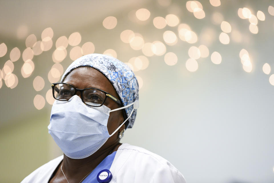 Nurse Marilynn Waldon talks about her experiences treating COVID-19 patients at East Alabama Medical Center in the Thursday, Dec. 10, 2020, in Opelika, Ala. Waldon had planned to retire this month but with the holidays approaching, she prayed and changed her mind. (AP Photo/Julie Bennett)