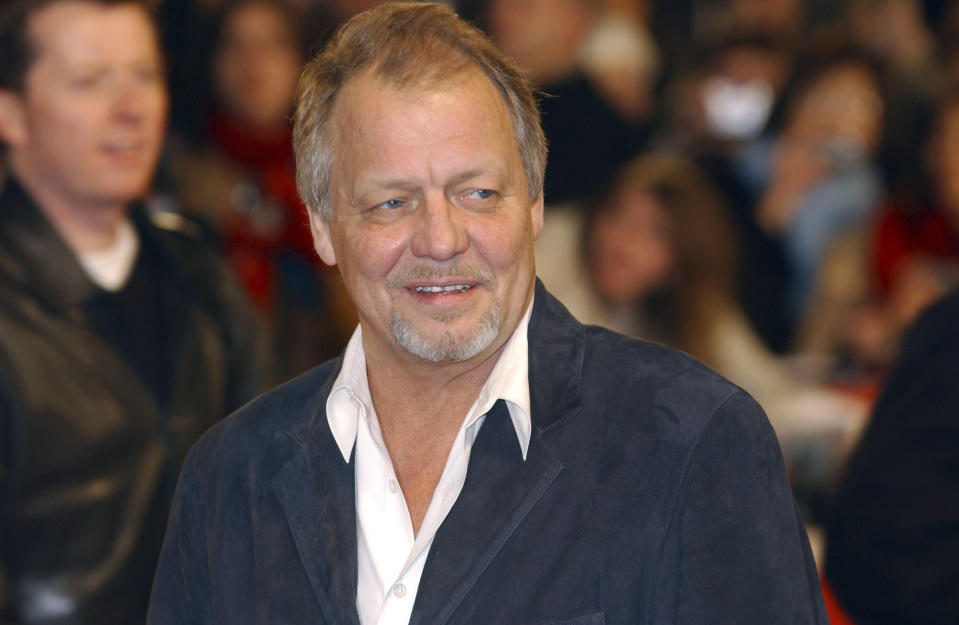 FILE - Actor David Soul arrives for the UK premiere of Starsky & Hutch at the Odeon Cinema in Leicester Square, central London, March 11, 2004. The actor who earned fame as the blond half of a crime-fighting duo in the popular 1970s television series “Starsky and Hutch” has died. David Soul was 80. His wife, Helen Snell, said Friday, Jan. 5, 2024 that Soul died on Thursday, "after a valiant battle for life in the loving company of family.” (Yui Mok/PA via AP, File)