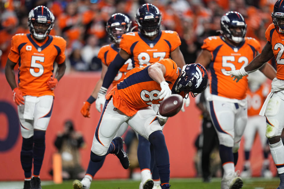 Denver Broncos tight end Eric Saubert (82) celebrates his touchdown against the Los Angeles Chargers during the second half of an NFL football game, Sunday, Nov. 28, 2021, in Denver. (AP Photo/Jack Dempsey)