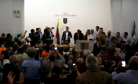 Venezuelan opposition leader Juan Guaido, who many nations have recognized as the country's rightful interim ruler, attends the meeting with public employees in Caracas, Venezuela March 5, 2019. REUTERS/Carlos Jasso