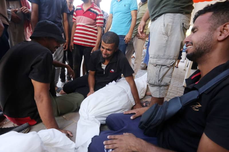 The bodies of Palestinians, including children, are taken to Al-Aqsa Hospital in the Dair EL-Balah district after the Israeli raid on the Maghzi refugee camp in the Gaza Strip. Omar Ashtawy/APA Images via ZUMA Press Wire/dpa