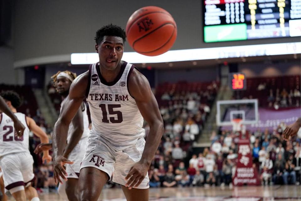 Texas A&M forward Henry Coleman III (15) goes for a loose ball against Mississippi during the first half of an NCAA college basketball game Tuesday, Jan. 11, 2022, in College Station, Texas. (AP Photo/Sam Craft)