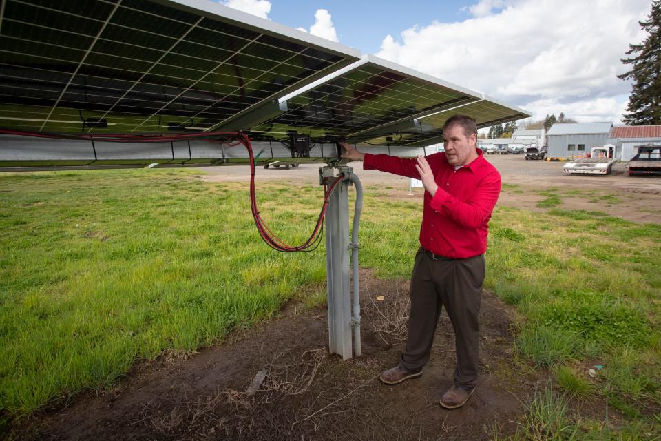 Oregon State University professor Chad Higgins explains the installation and articulation of an agrivoltaic solar array during a tour of the university’s Willamette Research and Extension Center in Aurora.