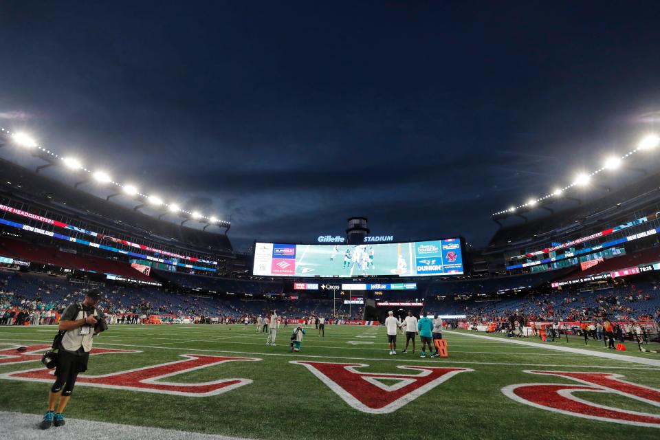 FILE — Lights illuminate Gillette Stadium before an NFL football game between the New England Patriots and the Miami Dolphins, Sunday, Sept. 17, 2023, in Foxborough, Mass. Police are investigating the death of a man following an "incident" in the stands at the New England Patriots home game Sunday. The Norfolk County district attorney's office says 53-year-old Dale Mooney, of Newmarket, N.H., "was in apparent need of medical attention." He was taken to a hospital, where he was pronounced dead. (AP Photo/Michael Dwyer, File)