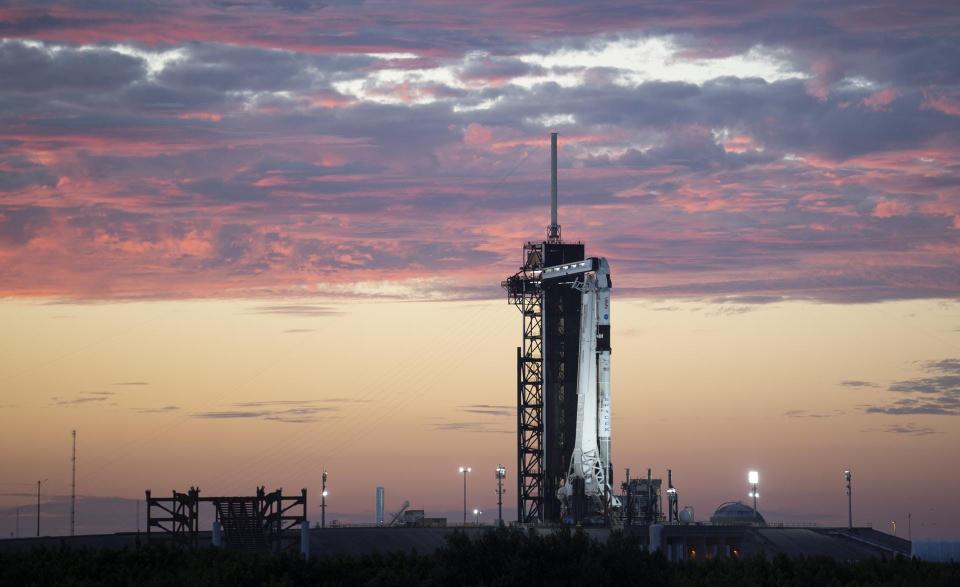 A SpaceX Falcon 9 rocket and Crew Dragon capsule stand ready at Kennedy Space Center's pad 39A on the evening of Wednesday, Oct. 27, 2021. Teams are now targeting no earlier than 1:10 a.m. Wednesday, Nov. 3, for the next attempt at launching the Crew-3 mission.