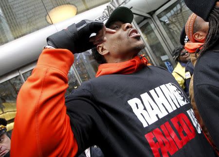 A protester chants slogans for the resignation of Chicago Mayor Rahm Emanuel as they march down Chicago's Michigan Avenue during a protest march against police violence in Chicago, Illinois December 24, 2015. REUTERS/Frank Polich