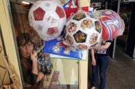 A woman sells souvenirs at Kremlin in Nizhny Novgorod, Russia, June 30, 2018. REUTERS/Damir Sagolj