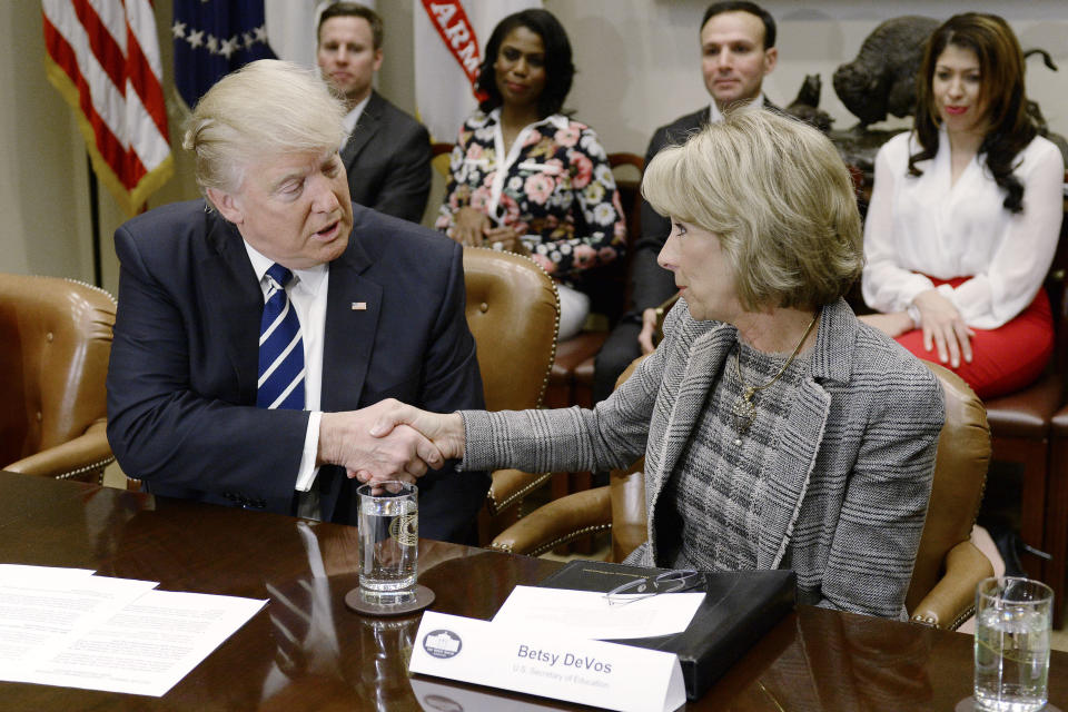 President Donald Trump shakes hands with Betsy DeVos during a parent-teacher conference listening session inside the Roosevelt Room of the White House on Tuesday, Feb. 14, 2017.&nbsp; (Photo: Bloomberg via Getty Images)